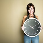 Woman holding wall clock