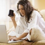Woman working at home with laptop computer