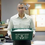 Businessman Holding Recycling Bin
