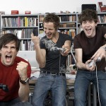 Colleagues celebrating victory on their video game